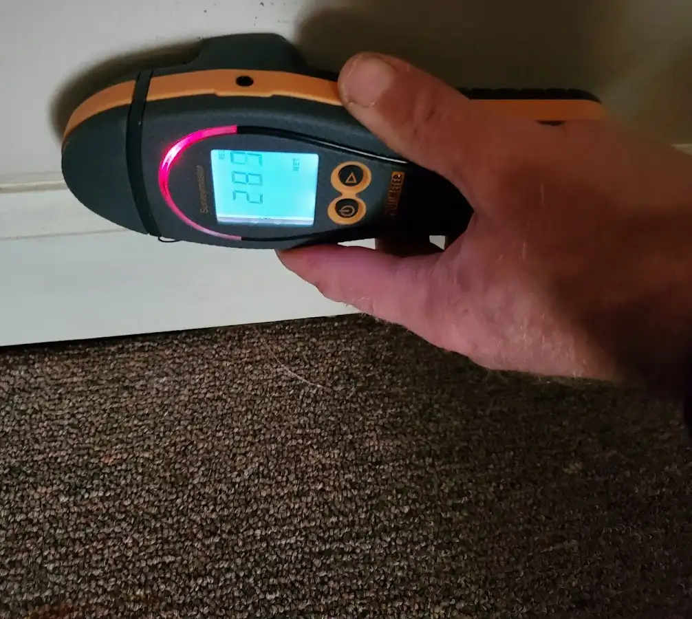 Moisture detection at baseboard during Storm Damage Restoration in Paramount